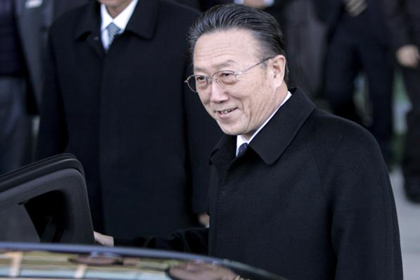 North Korean spy chief Kim Yang Gon gets in a car upon his arrival at the transit office near the truce village of Panmunjom in the demilitarized zone that separates the two Koreas in Paju north of Seoul in this file