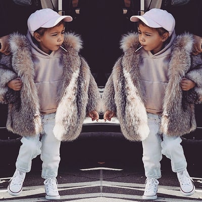 North West Sucks on Lollipop Wears $3,500 Fur Coat'Swag