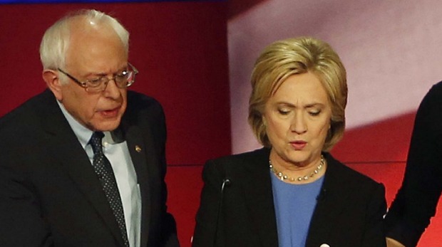 Not only clashing Hillary Clinton and Senator Bernie Sanders confer during a break