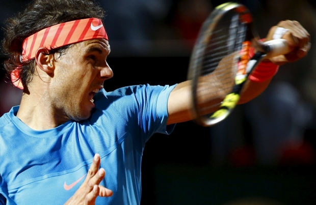 Rafael Nadal of Spain returns the ball to Stan Wawrinka of Switzerland during their men’s quarter-final match at the Rome Open tennis tournament in Rome Italy