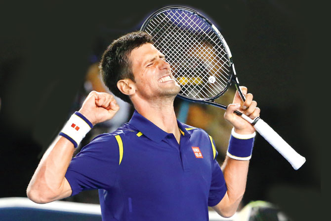 Novak Djokovic exults after beating Roger Federer in the Australian Open semi-final yesterday. Pic  Getty Images