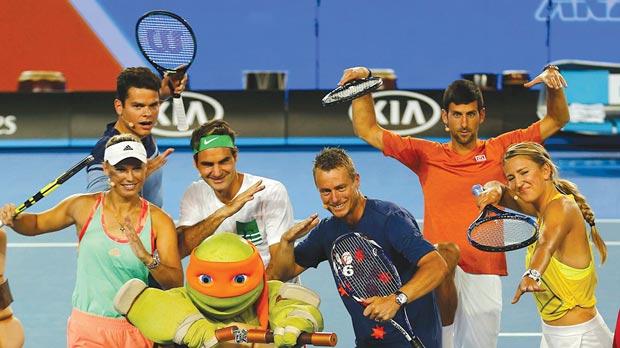 Left to right Caroline Wozniacki Milos Raonic Roger Federer Lleyton Hewitt Novak Djokovic and Victoria Azarenka during Kids Tennis Day at Melbourne Park yesterday