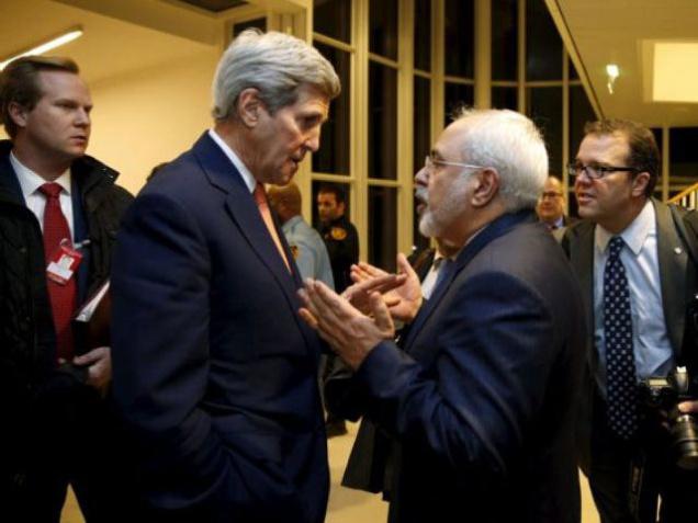 U.S. Secretary of State John Kerry with Iranian Foreign Minister Mohammad Javad Zarif on Saturday after the IAEA verified that the Islamic Republic has met all conditions under the nuclear deal in Vienna