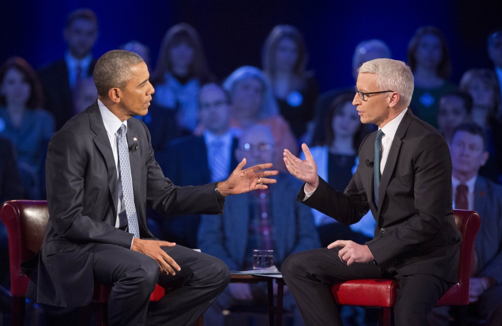 President Barack Obama left during a CNN televised town hall meeting hosted by Anderson Cooper right at George Mason University in Fairfax Va. Thursday Jan. 7 2016. Obama's proposals to tighten gun controls rules may not accomplish his goal