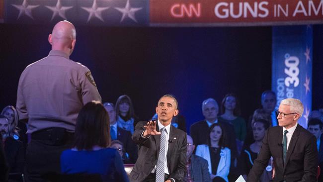 US President Barack Obama replies to a question by Arizona Sheriff Paul Babeu at a town hall meeting in Virginia which was aired live on Thursday by CNN