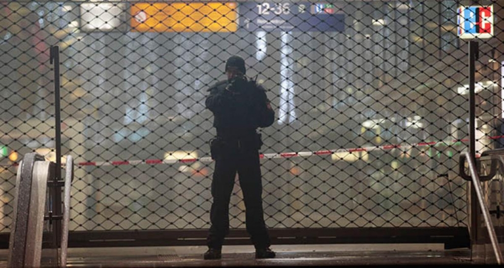 Officer guards southern gate to Munich main station Pic Getty