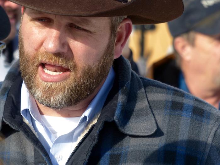 Ammon Bundy chats with a protester Saturday Jan. 2 2016 during a march on behalf of a Harney County ranching family in Burns Ore. Bundy the son of Nevada rancher Cliven Bundy who was involved in a standoff with the government over grazing rights