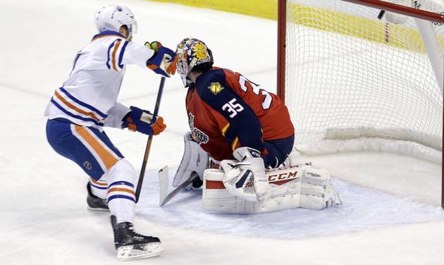 Edmonton Oilers left wing Taylor Hall left scores against Florida Panthers goalie Al Montoya during the first period of an NHL hockey game Monday Jan. 18 2016 in Sunrise Fla