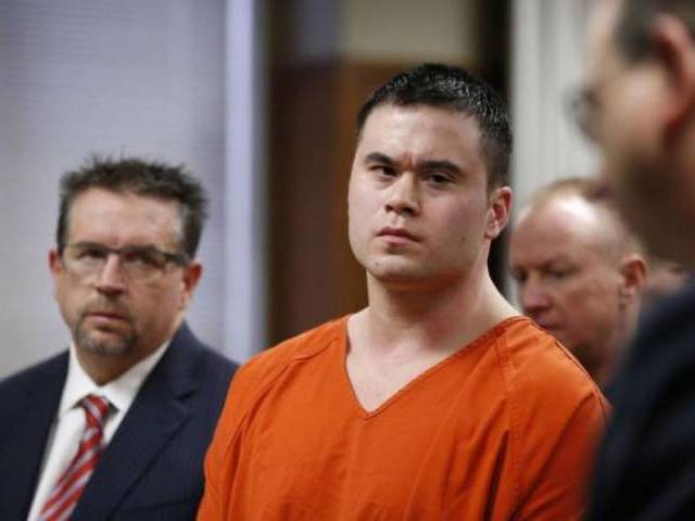 Former Oklahoma City police officer Daniel Holtzclaw, stands with his defense attorney Scott Adams, as his sentence is read during hearing in Oklahoma City Oklahoma