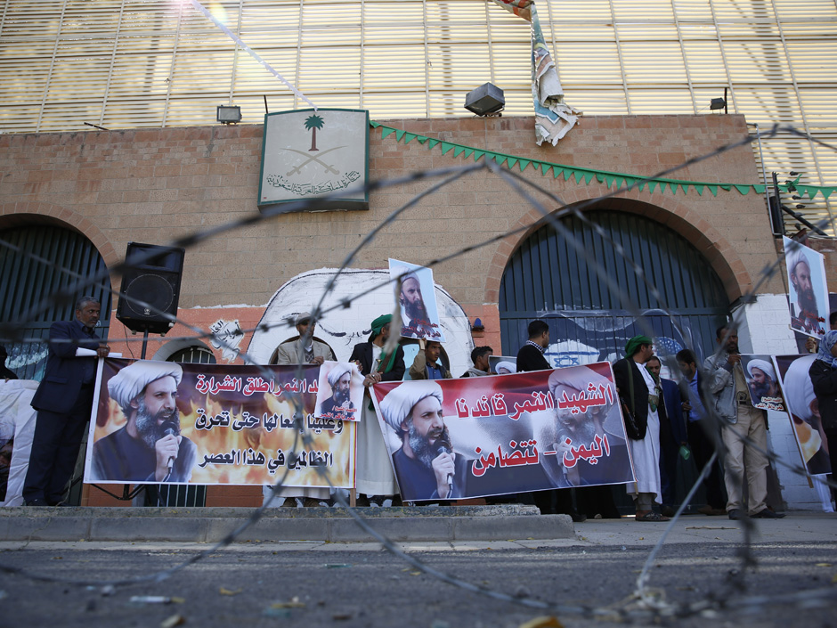 Shiite rebels known as Houthis hold posters of late Shiite cleric Nimr al-Nimr who was executed in Saudi Arabia during an anti Saudi protest outside the Saudi embassy in Sanaa Yemen Thursday Jan. 7 2016