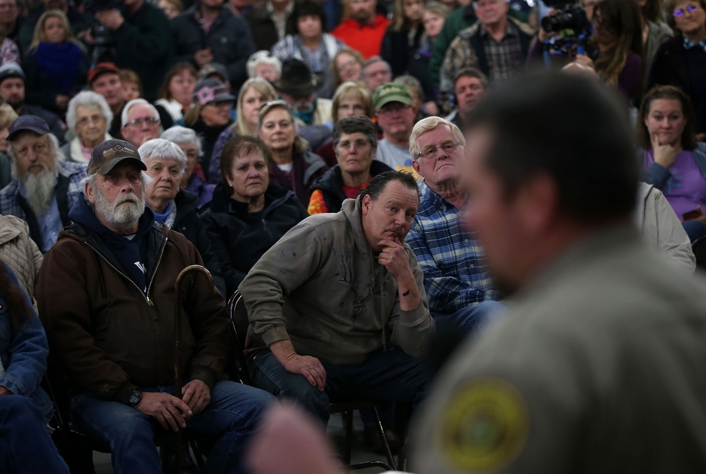 Harney County residents in rural Oregon look on as Harney County Sheriff David Ward speaks during a community meeting at the Harney County fairgrounds in Burns Oregon. Jan. 6 2016. Hundreds of Harney County residents attended a community meeting to expr