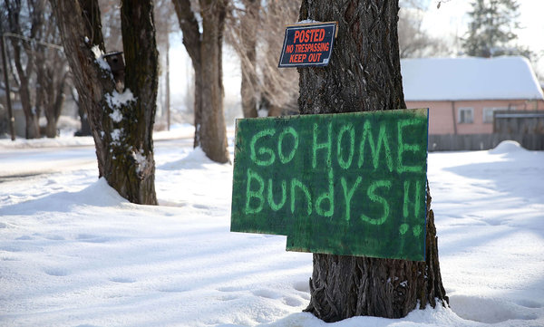 A sign referencing militia leaders Ammon and Ryan Bundy is posted in front of a home in Burns Ore