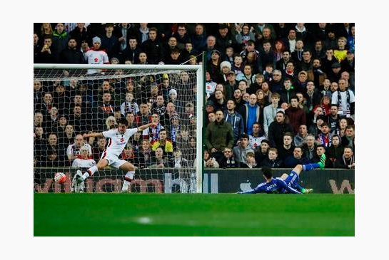 Chelsea's Oscar right scores his side's first goal during the English FA Cup fourth round soccer match between Milton Keynes Dons and Chelsea at Stadium mk in Milton Keynes England Sunday Jan. 31 2016