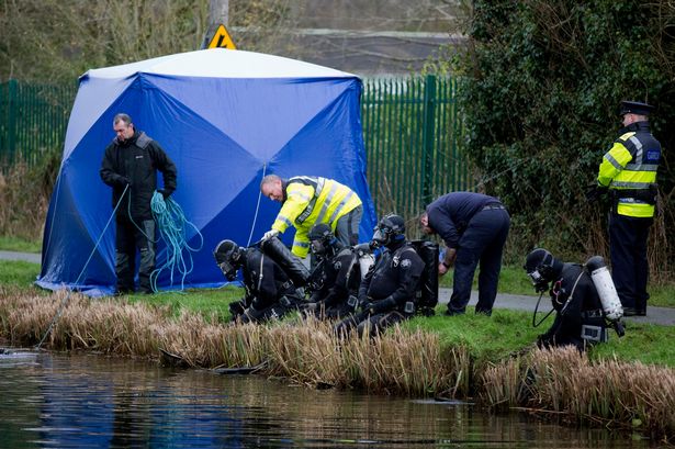 Members of the Garda at the scene near the village of Ardclough Co Kildare where a body was found inside a container dumped in the Grand Canal