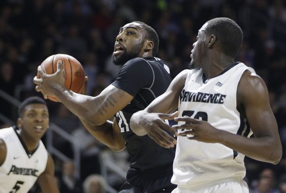 Jones drives to the hoop past Providence forward Rodney Bullock and guard Junior Lomomba during the second half of an NCAA college basketball game Tuesday Jan. 19 2016 in Providence R.I. Providence defeat