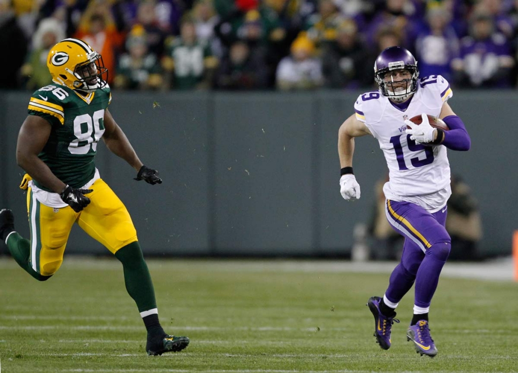 Minnesota Vikings&#039 Adam Thielen runs past Green Bay Packers&#039 Kennard Backman on a fake punt during the first half an NFL football game Sunday Jan. 3 2016 in Green Bay Wisconsin