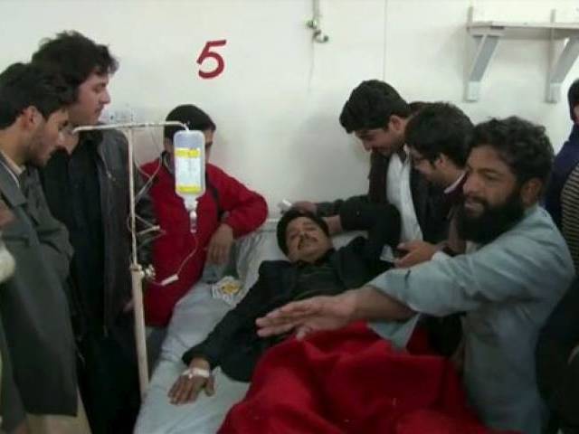 Relatives and friends surround a man injured in a militant attack at the Bacha Khan University at a hospital in Charsadda in this still image taken from a video