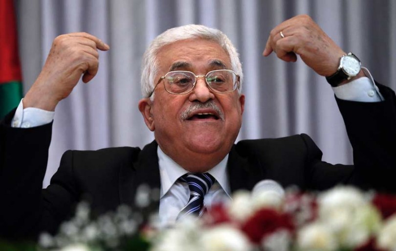 Palestinian President Mahmud Abbas speaks during a Christmas lunch with members of the Christian Orthodox community