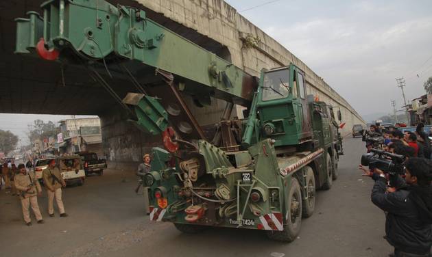 An Indian army truck carrying military equipment moves towards the Indian air force base in Pathankot India Monday Jan.4 2016. The attack at the air base near the border with Pakistan began early Saturday morning and has dragged on as government troop