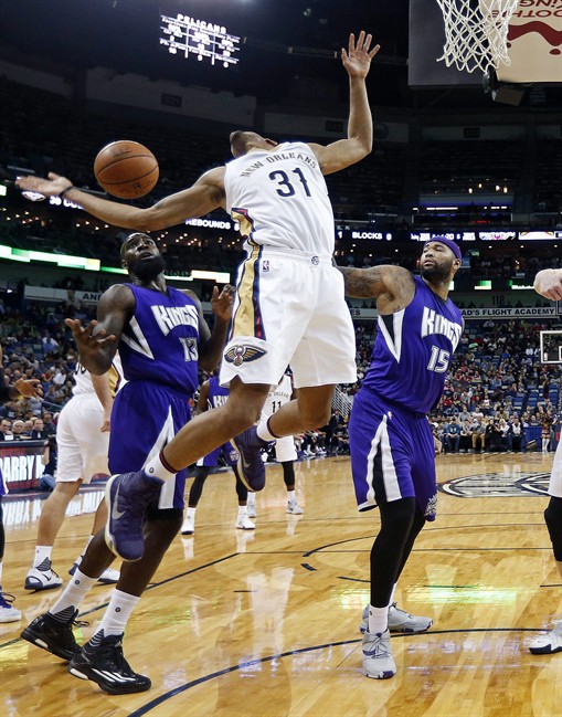 New Orleans Pelicans guard Bryce Dejean Jones loses the ball as Sacramento Kings forward Quincy Acy and center De Marcus Cousins defend during the first half of an NBA basketball game in New Orleans Thursday Jan. 28 2016. (AP