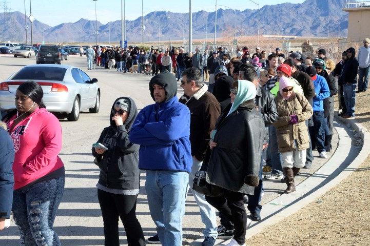 People wait in line to buy tickets for the Powerball lottery at the CA lotto store in San Bernardino County California on Saturday