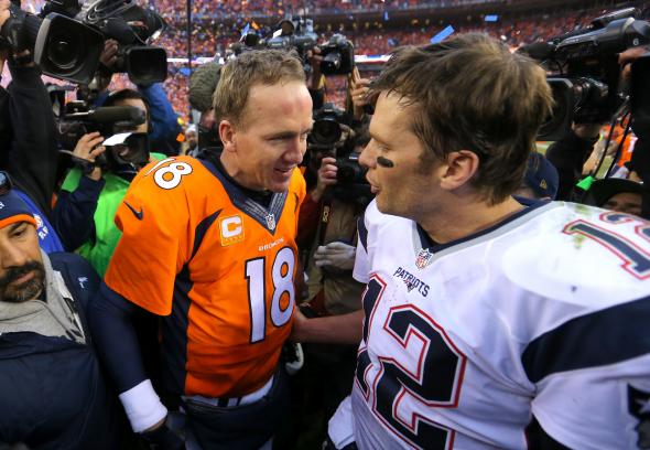 506637246-peyton-manning-of-the-denver-broncos-and-tom-brady-of