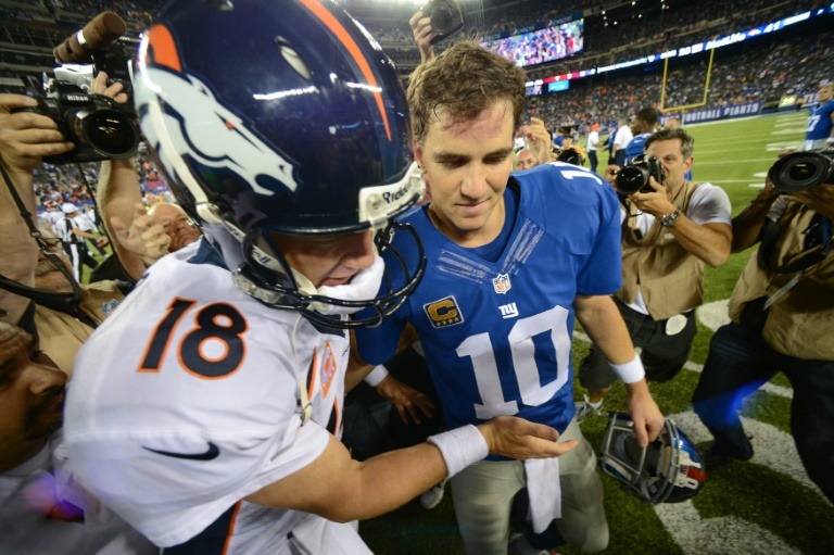 Getty  AFP  File  Ron Antonelli Quarterback Peyton Manning of the Denver Broncos and brother quarterback Eli Manning #10 of the New York Giants shake hands after a game