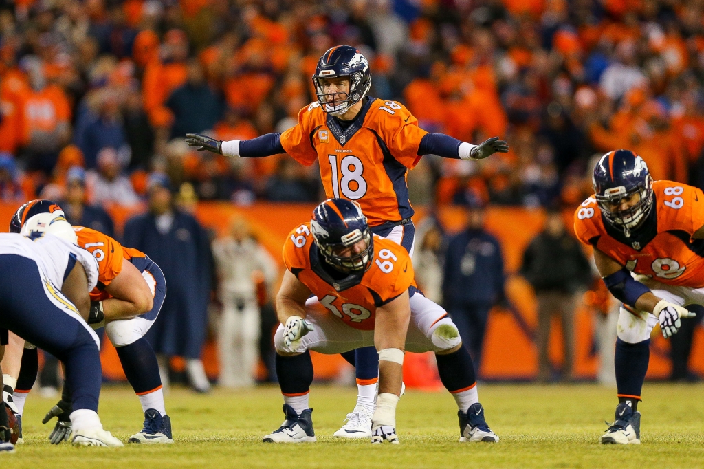 Quarterback Peyton Manning #18 of the Denver Broncos runs the offense against the San Diego Chargers during a game at Sports Authority Field at Mile High