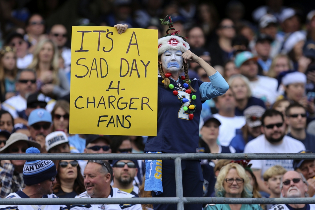 LytleA Chargers fan holds up a sign during the last game of the season at Qualcomm Stadium