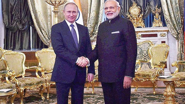 Prime Minister Narendra Modi shaking hands with Russian President Vladimir Putin at a restricted meeting in Green Room in Kremlin | PTI