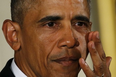 President Obama wipes away tears while speaking about gun violence Tuesday at the White House