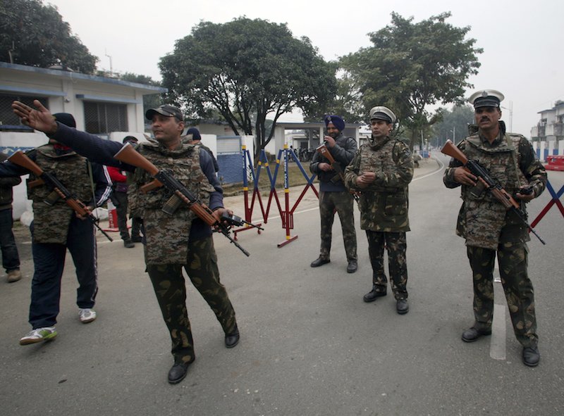 Indian security personnel stand guard inside the Indian Air Force base at Pathankot in Punjab India today. Security forces are working to carefully defuse grenades in the final stages of an operation to secure a vast air base near the border with Pakist