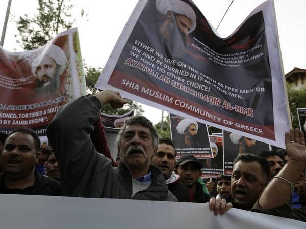 Shia Muslims who live in Greece shout slogans during a rally against the execution of cleric Sheikh Nimr al-Nimr outside Saudi Arabia´s Embassy in Athens Wednesday Jan. 6 2016. Saudi Arabia executed last Saturday Shiite cleric Sheikh Nimr al Nimr