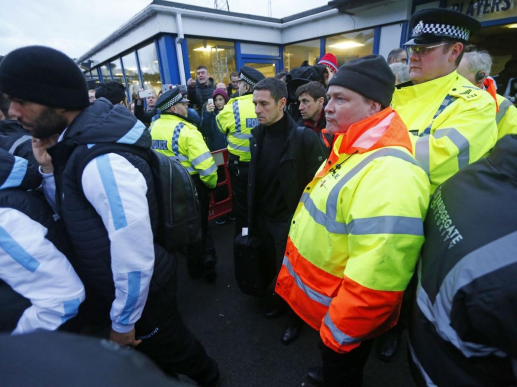 Rémi Garde is given a police escort away from Wycombe Reuters