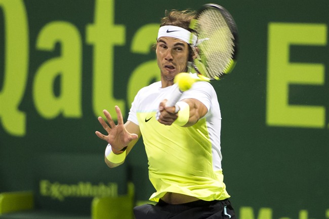 Spain's Rafael Nadal returns the ball during a match against Andrey Kuznetsov of Russia at Qatar Open tennis tournament Thursday Jan. 7 2016 in Doha Qatar