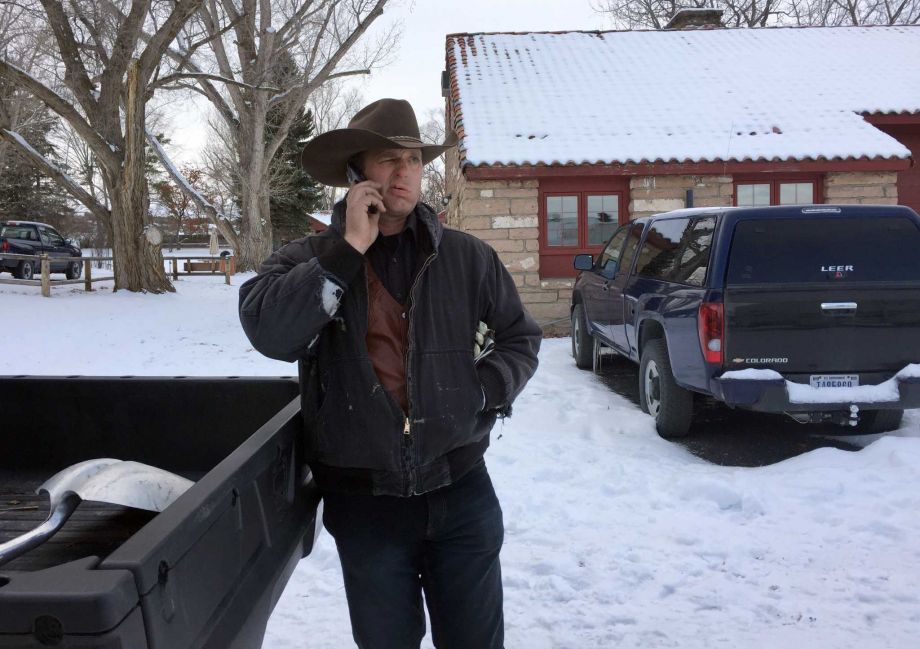 Ryan Bundy talks on the phone at the Malheur National Wildlife Refuge near Burns Ore. Sunday Jan. 3 2016. Bundy is one of the protesters occupying the refuge to object to a prison sentence for local ranchers for burning federal land