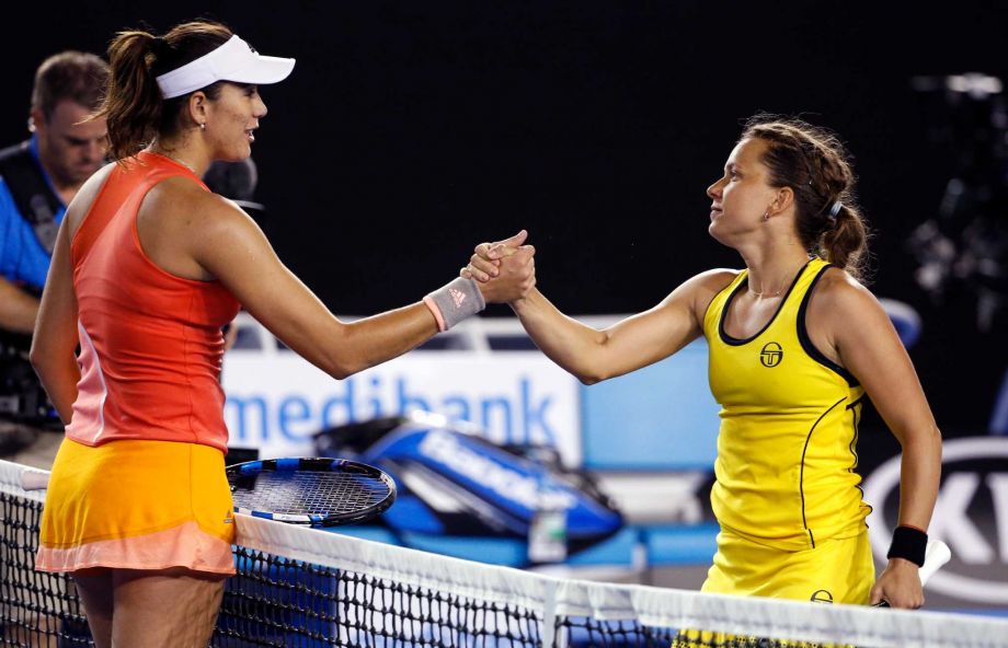 Barbora Strycova right of the Czech Republic is congratulated by Garbine Muguruza of Spain following their third round match at the Australian Open tennis championships in Melbourne Australia Saturday Jan. 23 2016