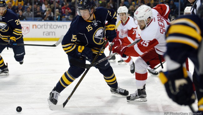 Buffalo Sabres center Jack Eichel battles for the puck with Detroit Red Wings center Riley Sheahan right on a face-off during the first period of an NHL hockey game Saturday Jan. 2 2016 in Buffalo N.Y