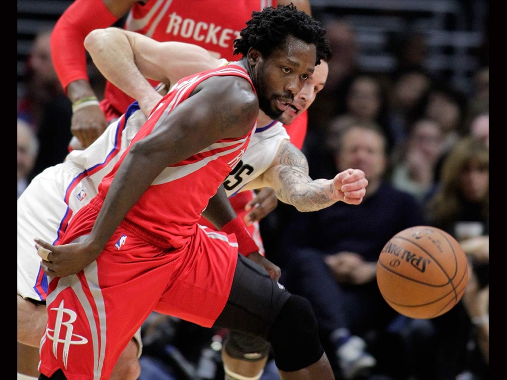 Los Angeles Clippers guard J.J. Redick right knocks the ball away from Houston Rockets guard Patrick Beverley left during the first half of an NBA basketball game in Los Angeles Monday Jan. 18 2016