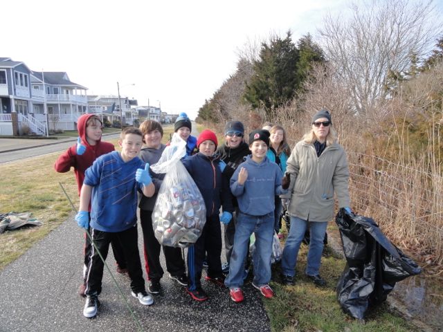 A group including Aodhan Daly and his mom Mary Daly, Bridget Dougherty Sierra Ortiz Brett Oves Zachary and Sean Mazzitelli Ricky Urban Race Meyers and Justin Bush clean near the Howard S. Stainton Wildlife Refuge in Ocean City