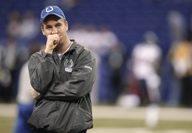 Indianapolis Colts quarterback Peyton Manning stands on the field before the team's NFL football game against the H