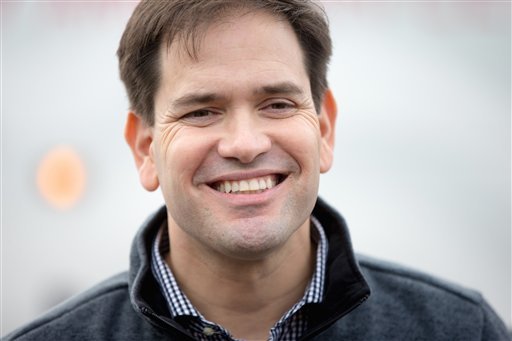 Republican presidential candidate Sen. Marco Rubio R-Fla. smiles as he talks to members of the media following his speaking at Rastrelli's Tuscany Special Events Center in Clinton Iowa Tuesday Dec. 29 2015