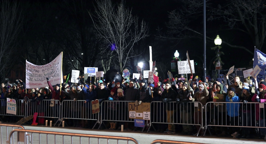 Residents stand across the street from the Flynn to protest Donald Trump's rally Jan. 7. RYAN THORNTON  The Vermont Cynic