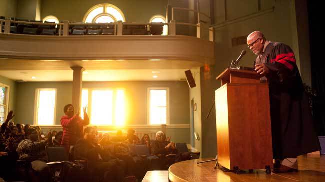 Rev. Dr. Michael Isaac addresses attendees of the 2015 celebration of Dr. Martin Luther King Jr.'s birthday at the Cultural Center in Lincolnton