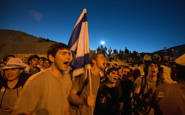 Right-wing Israelis march from the Jewish settlement of Maale Adumim to the E1 area