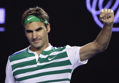 Roger Federer celebrates after defeating Grigor Dimitrov in their third-round match at the Australian Open