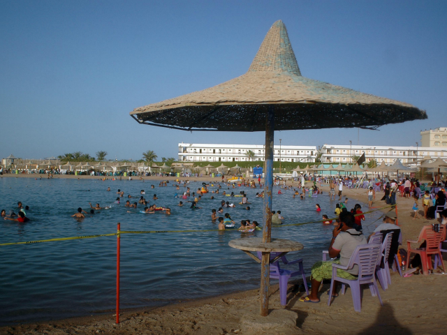 Egyptians enjoy the public beach along the Red Sea resort of Hurghada in southern Egypt