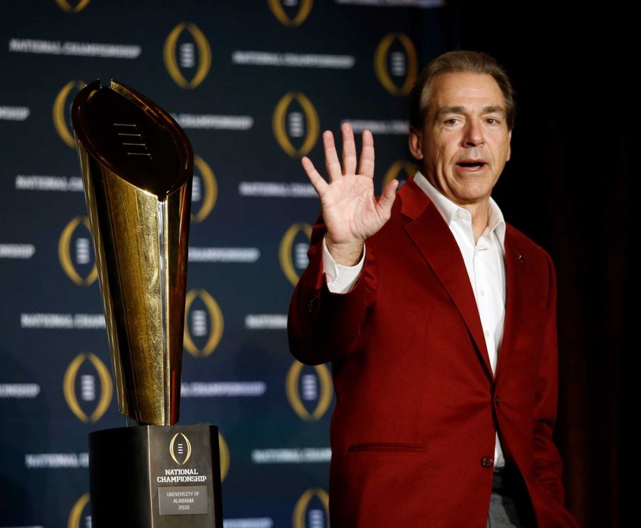 Alabama head coach Nick Saban poses with the championship trophy during a news conference for the NCAA college football playoff championship Tuesday Jan. 12 2016 in Scottsdale Ariz. Alabama beat Clemson 45-40 to win the championship