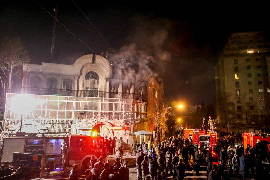 Smoke rises as Iranian protesters set fire to the Saudi embassy in Tehran Sunday Jan. 3 2016. Protesters upset over the execution of a Shiite cleric in Saudi Arabia set fires to the Saudi embassy in Tehran. ORG XMIT E