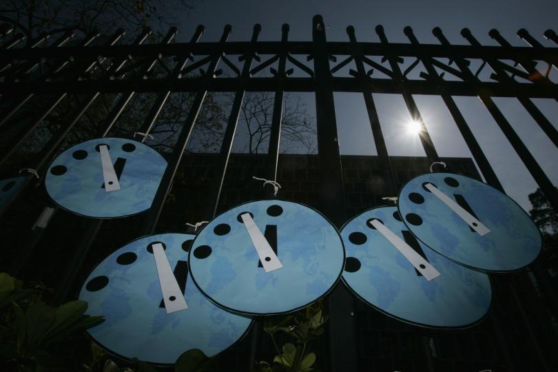 Doomsday clocks on a gate in Hong Kong